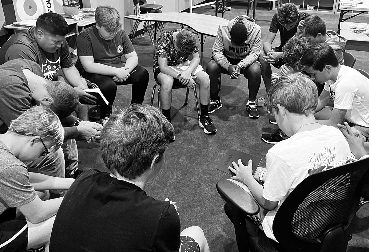 Boys small group praying